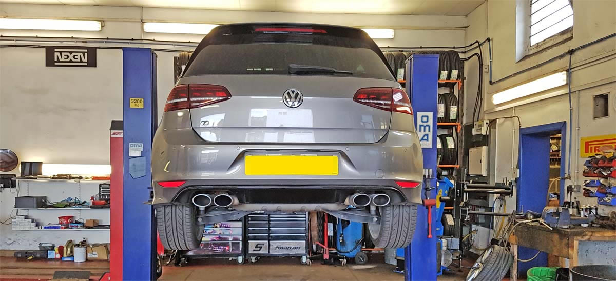 Car on ramp ready to be serviced.